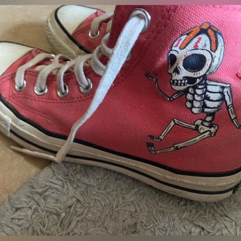 pink converse with design on the side